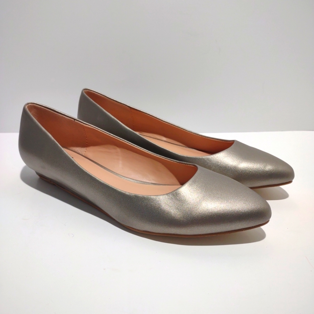 Metallic Gold Almond toe flats.